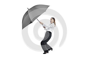 Asian businesswoman holding black umbrella