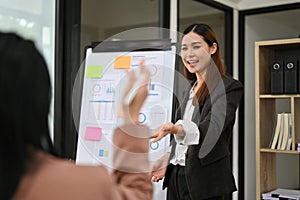 Asian businesswoman lead the meeting, discussing and sharing ideas with her team