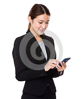 Asian Businesswoman look at the mobile phone