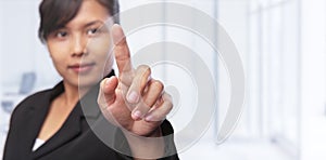 Asian businesswoman pointing her hand