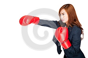 Asian businesswoman punch with boxing glove