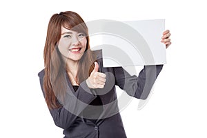 Asian businesswoman show thumbs up hold a blank sign