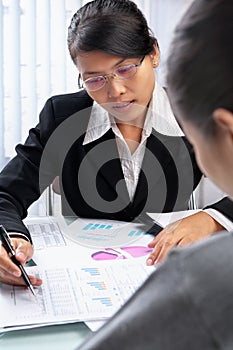 Asian businesswoman showing data