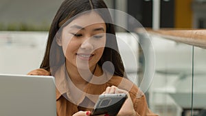 Asian businesswoman sit at cafe table with laptop chinese multiethnic woman girl korean japanese student freelancer