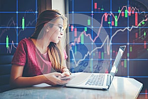 asian businesswoman sitting amd working Laptop Stock market exchange information and Trading graph