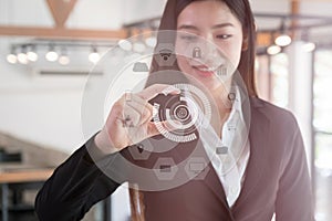 Asian businesswoman smiling and gesturing sizes with fingers. bu