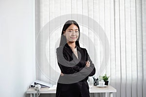 Asian businesswoman. stand happy smile Proud of business success the office