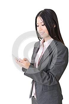Asian businesswoman typing on cell phone