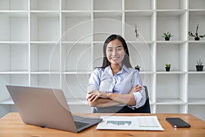 Asian businesswoman working for financial graphs showing results about their investments, planning successful business