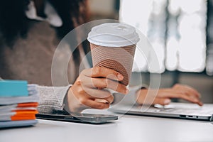 Asian businesswoman working on laptop computer Look for job online, freelance looking and typing on notebook on table, lifestyle