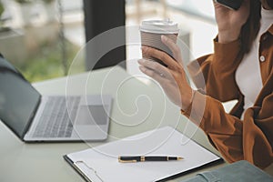 Asian businesswoman working on laptop computer Look for job online, freelance looking and typing on notebook on table, lifestyle