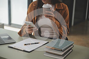 Asian businesswoman working on laptop computer Look for job online, freelance looking and typing on notebook on table, lifestyle