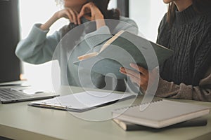 Asian businesswoman working on laptop computer Look for job online, freelance looking and typing on notebook on table, lifestyle