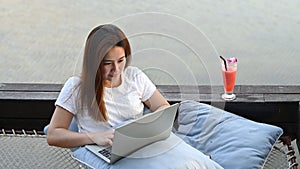 Asian businesswoman working online at the beach. Freelancer using technology for work everywhere. New normal lifestyle