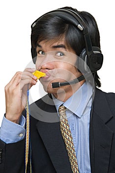 Asian call center agent blowing whistle