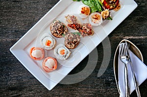 Asian canapes appetizer - Smoked salmon, maki, larb, tuna tartar