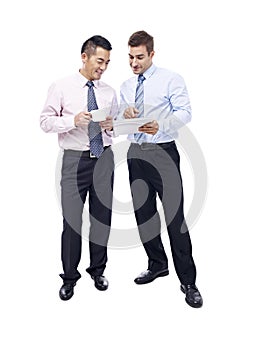 Asian and caucasian businessmen having a discussion