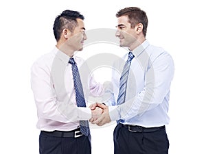 Asian and caucasian businessmen shaking hands