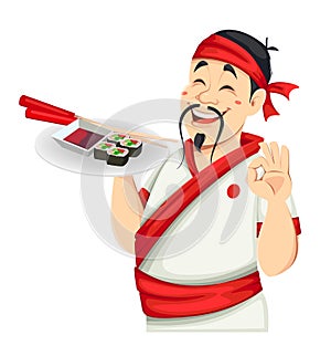 Asian chef holding sushi. Handsome Japanese cook