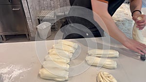 Asian chef preparing dough for handmade pulled noodles