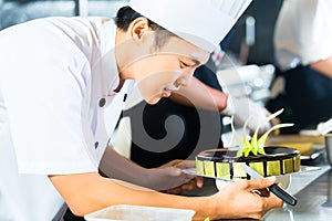 Asian chefs cooking in Restaurant