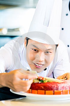 Asian chefs cooking in Restaurant