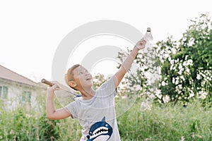 Asian child boy are playing Badminton outdoor in sunset