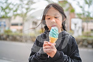Asian Child Eating Ice Cream