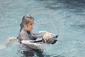 Asian child girl drowning in underwater,drowning female teenager in swimming pool,mother rescuing unconscious daughter drowning in