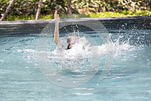 Asian child girl struggling underwater, hand peeking out of the water, female drowned in swimming pool, drowning woman in swimming