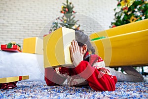 Asian child girl surprise with gift and holding beautiful gift box in hand on Christmas celebration