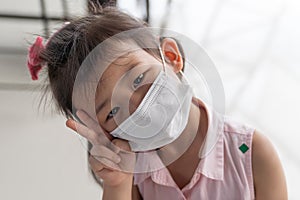 Asian child girl wearing a protection mask