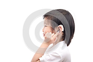 Asian child with hearing aid