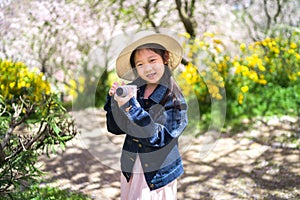 Asian Child Holding Camera Taking Photo on Travelling Trip During Vacation