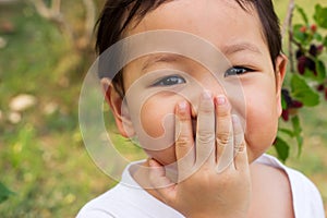 Asian child laughing gag. Close up in her eyes. Feeling happiness