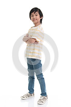 Asian child looking with crossed arms on white background isolated