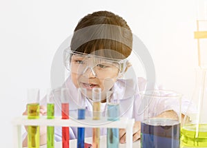 Asian child playing scientist with colorful lab tubes