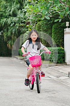 Asian Child Riding Bicycle
