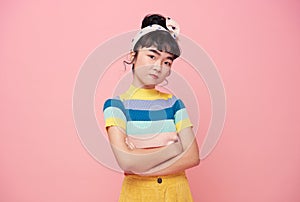 Asian child Sad and unhappy  on pink background