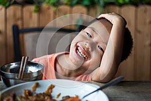 Asian child smiling at the restaurant photo