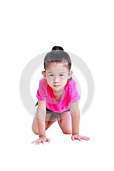 Asian child in sportwear crawling on knees at studio.