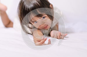 Asian child toddler girl making mini heart sign by her hand