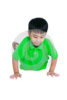 Asian child warming up and doing push-ups. Isolated on a white b