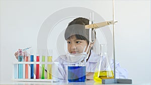 Asian children girl testing chemical in laboratory