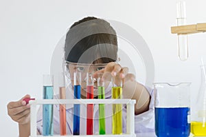 Asian children girl testing chemical in laboratory