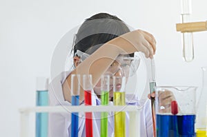 Asian children girl testing chemical in laboratory