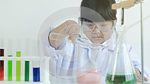 Asian children girl testing chemical in laboratory