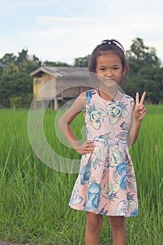 asian children in green rice field