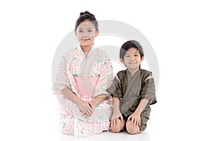 Asian children in Japanese Traditional Dress sitting