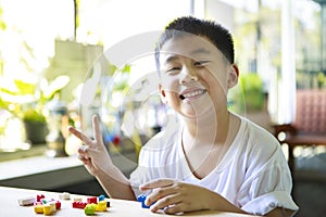 Asian children playing kid toy at home